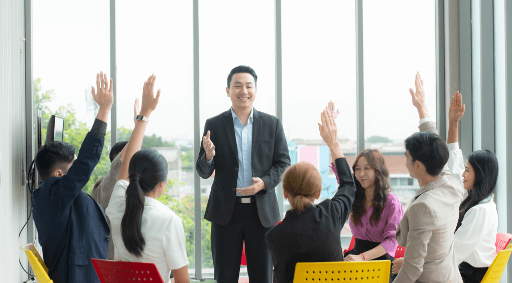 A leader engaging with a team and encouraging feedback during a session